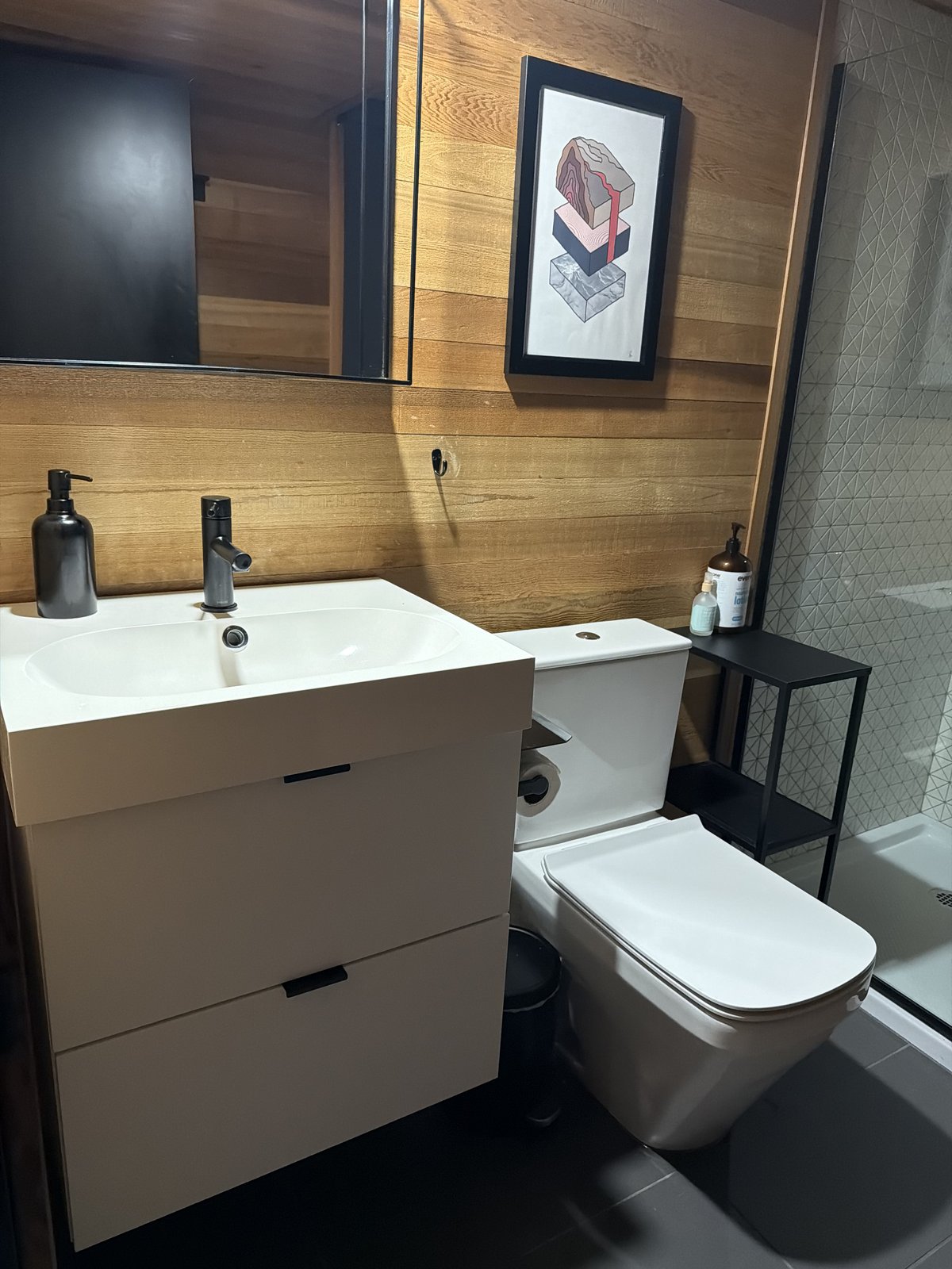 Modern bathroom with white vanity and toilet