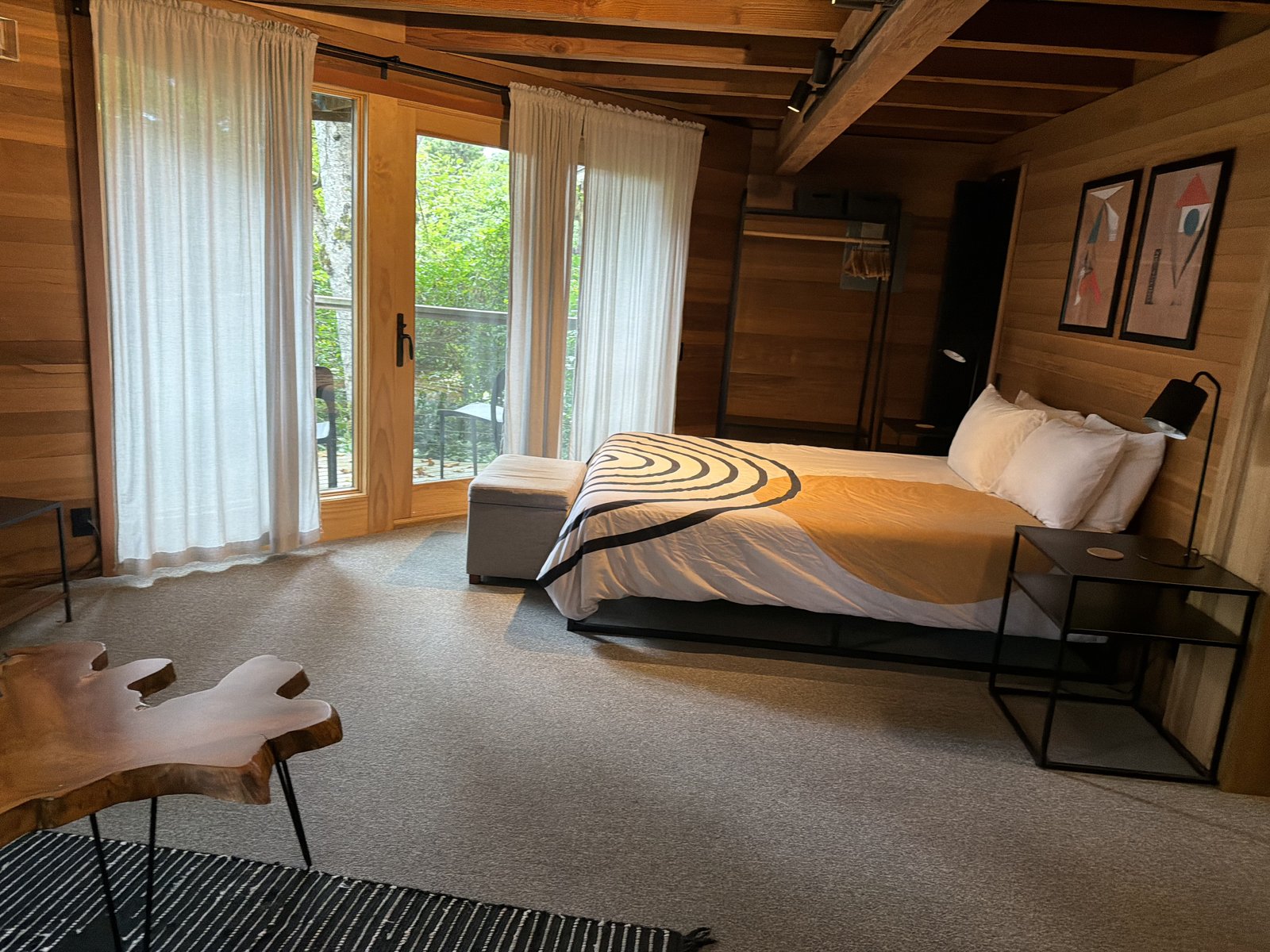 Cozy wood-paneled bedroom with neatly made bed