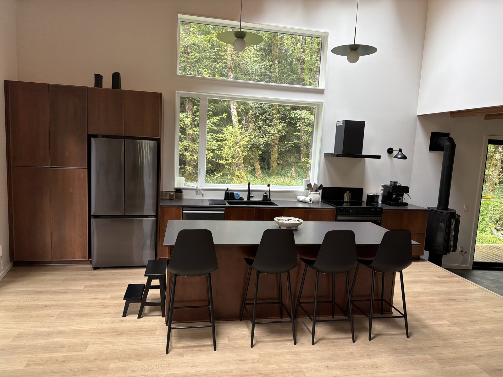 Modern open kitchen and dining area cleaned top to bottom